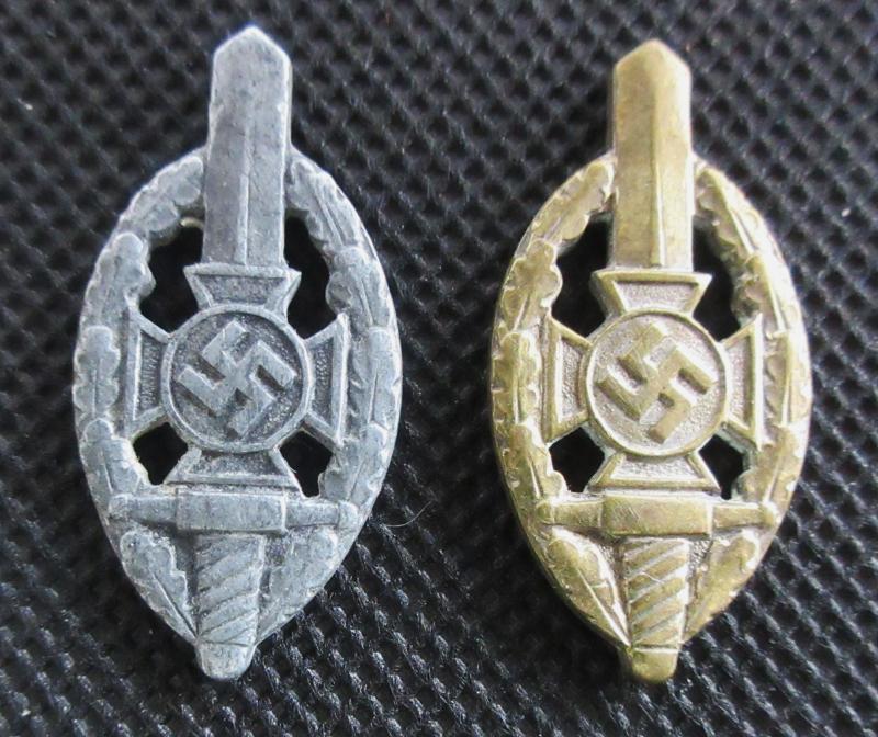 2 SMALL PINLESS NSKOV BADGES